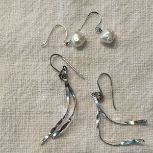 Two pairs of earrings both sterling silver one has freshwater pearls